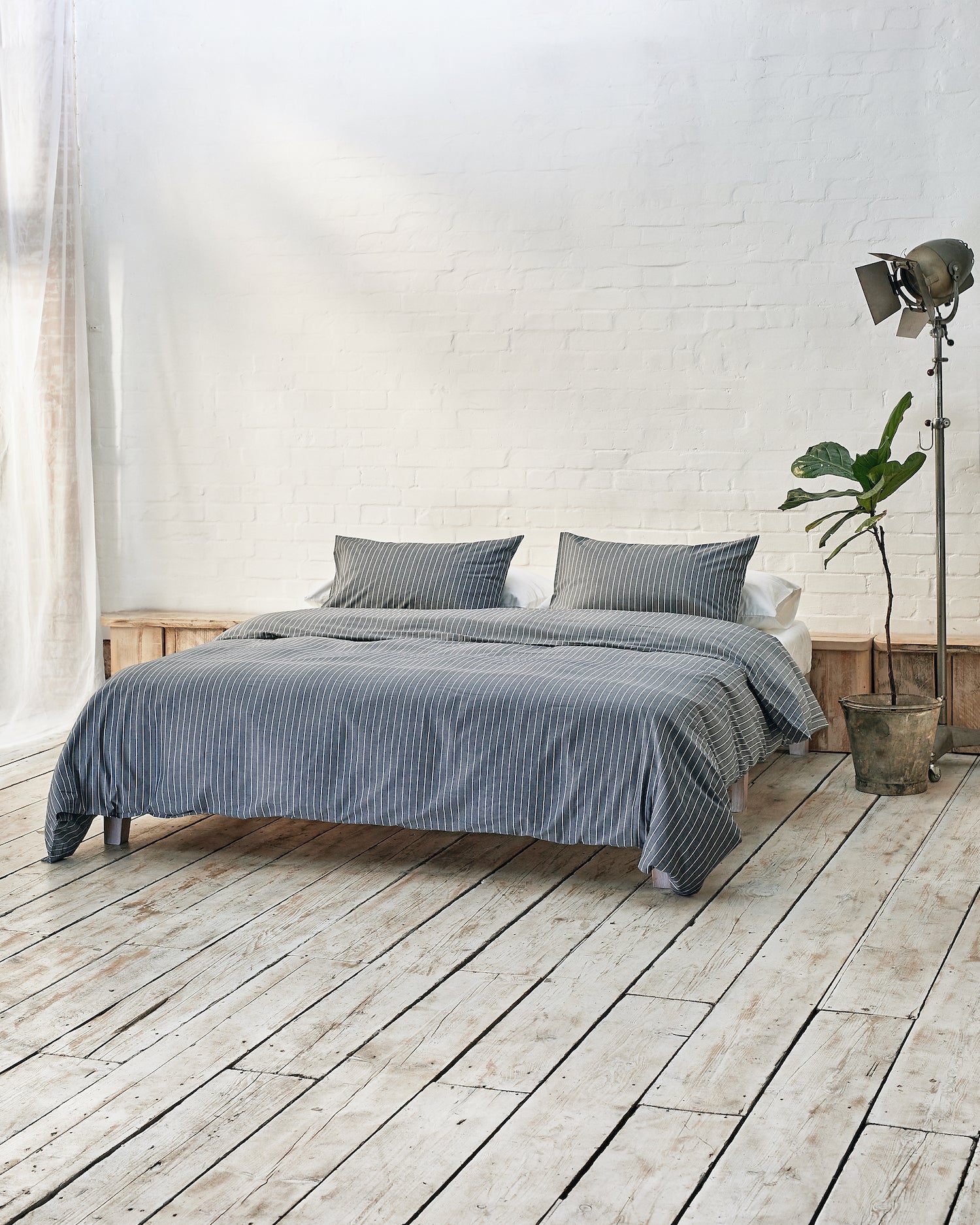 Lifestyle image of graphite blue bedding.