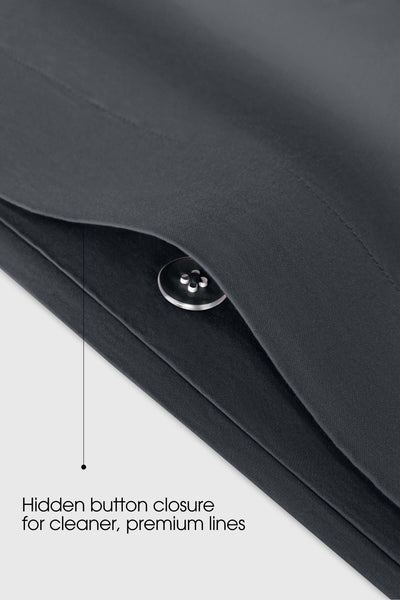 Concealed button fastening on a dark grey sateen duvet cover, close up