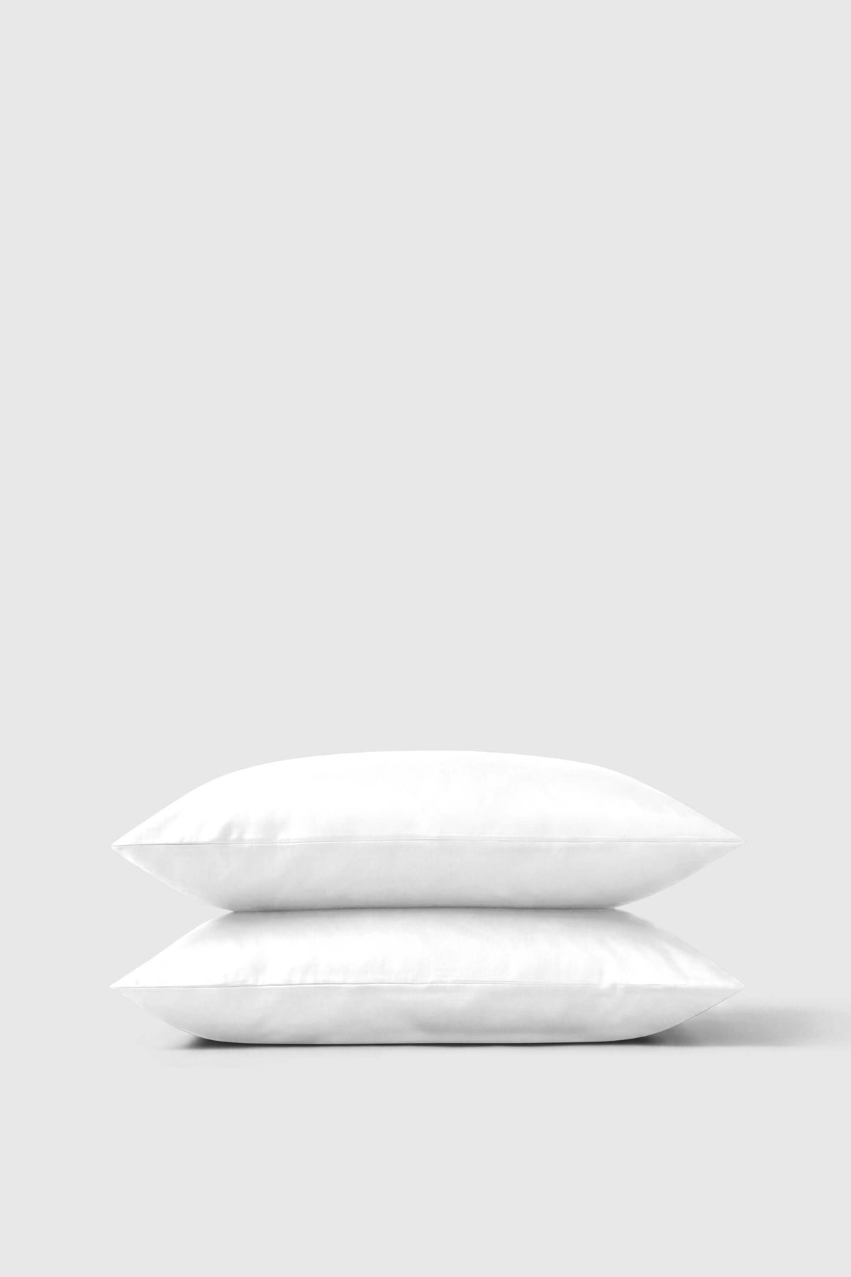 Bedable cotton sateen pillows in white pillowcases